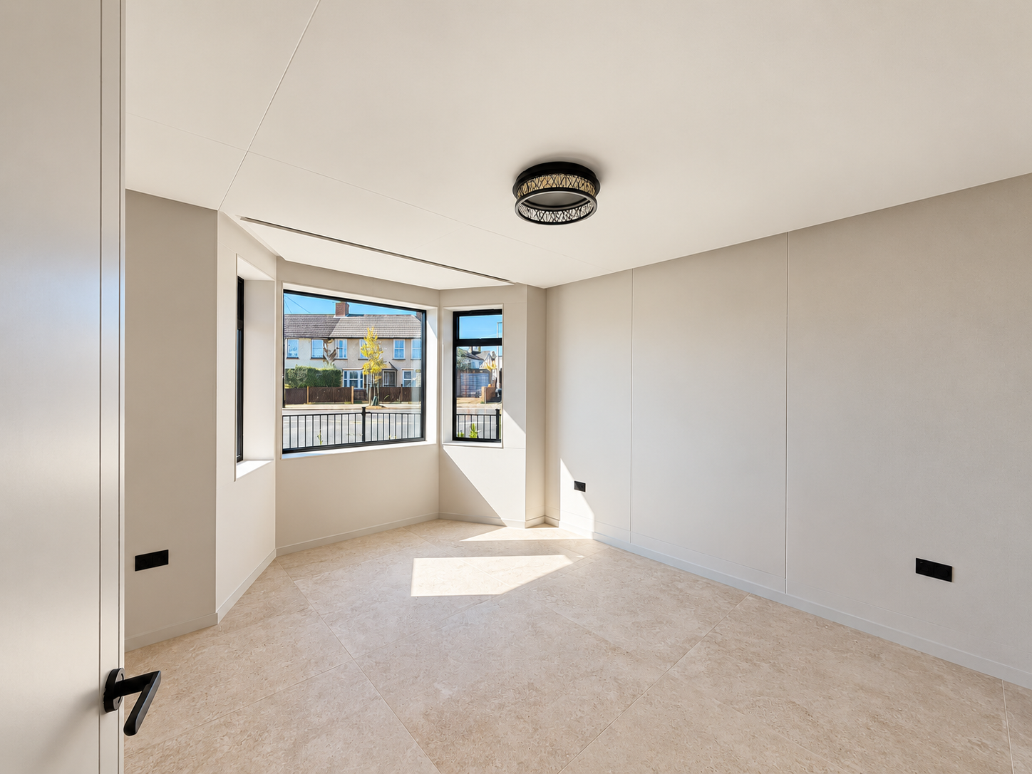 Bright ground floor room with bay window and stone floor